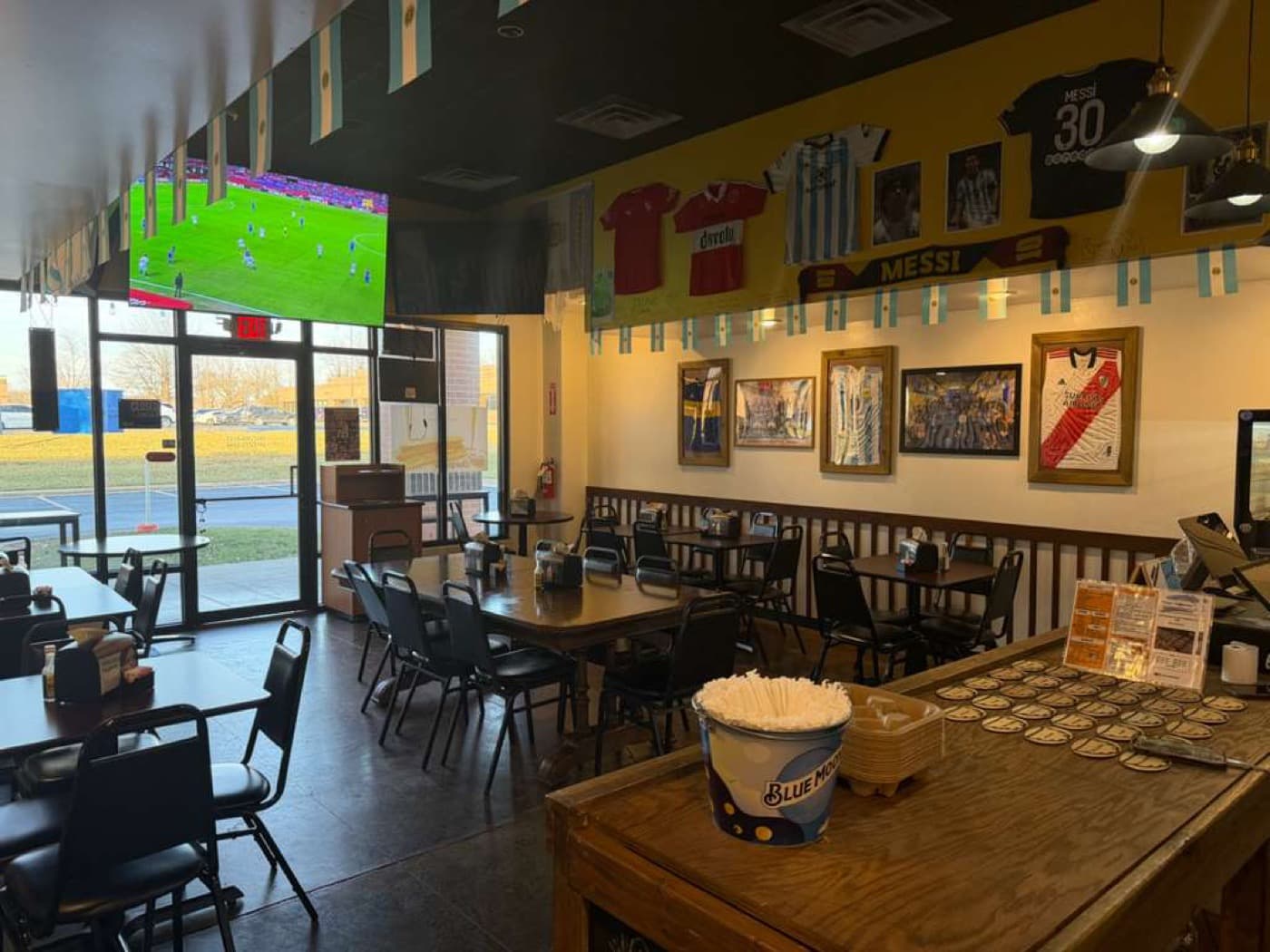 Dining room with the game on TV
