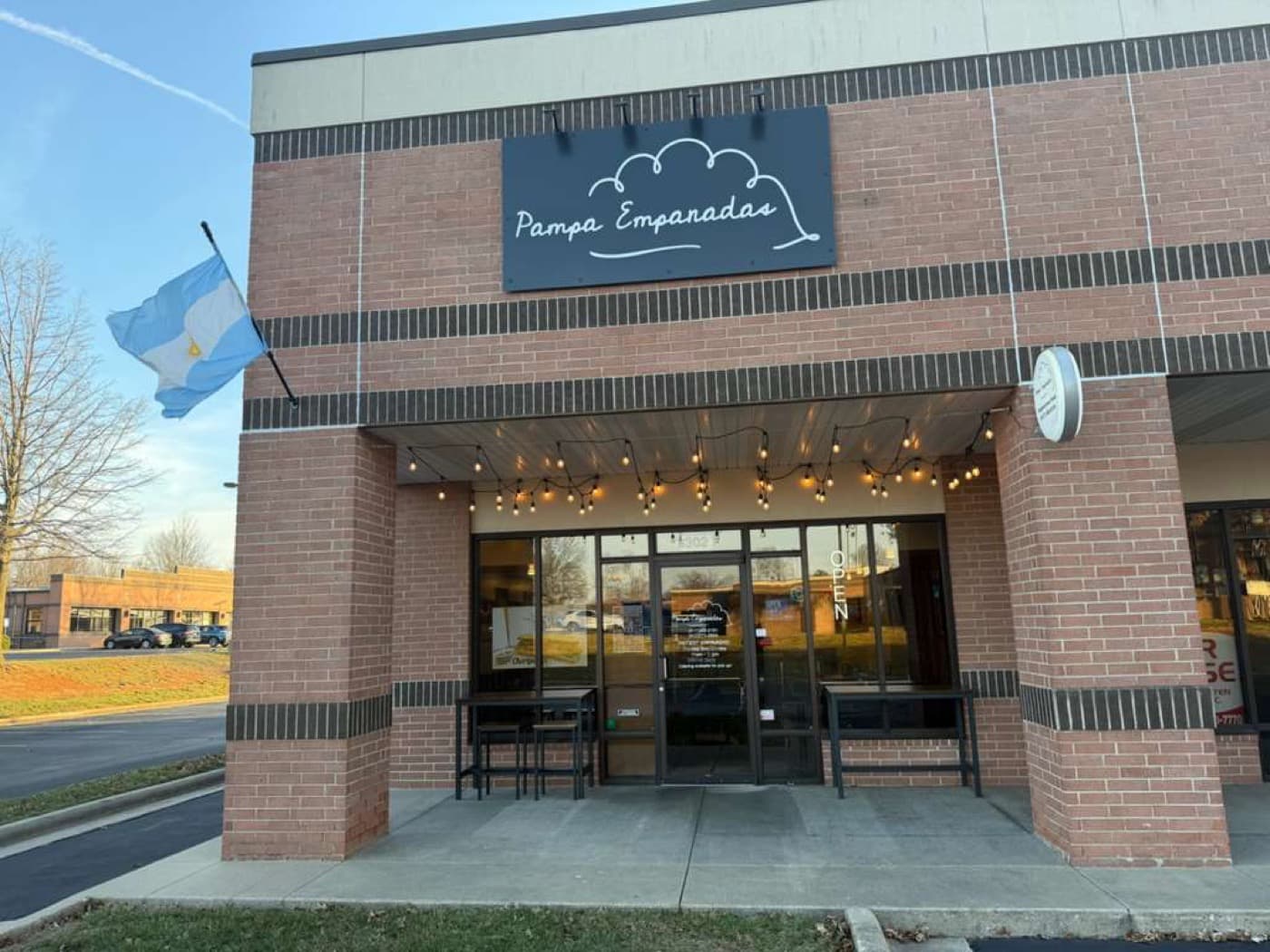 Pampa Empanadas storefront with the Argentine flag