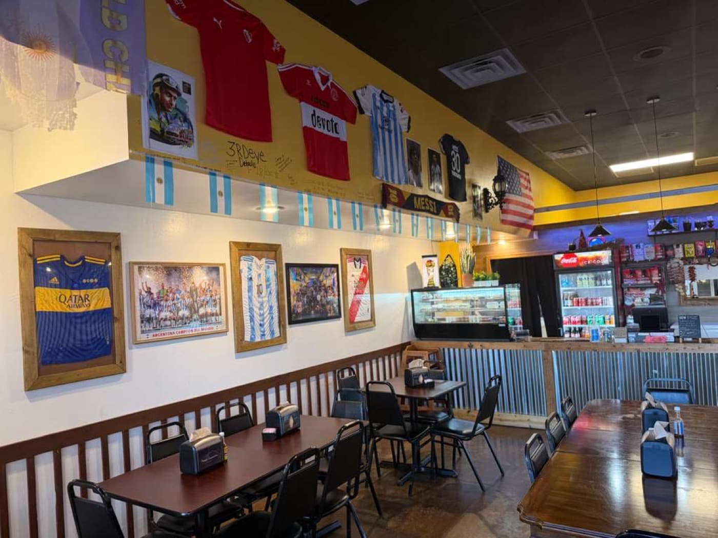 Dining room with soccer jerseys on the wall